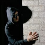Woman in Black Hoodie Wearing Sunglasses