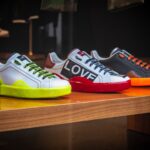 Three Unpaired Multicolored Leather Sneakers on Display