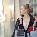 Woman Wearing Black Blazer Holding Shopping Bags