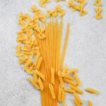 yellow plastic cone on gray sand