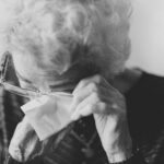 woman wiping her eyes