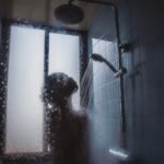 woman under showerhead