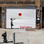 red balloon on black steel post