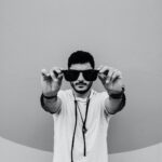 man holding sunglasses