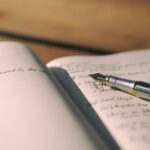pen on white lined paper selective focus photography