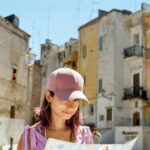 woman wearing pink fitted cap in city