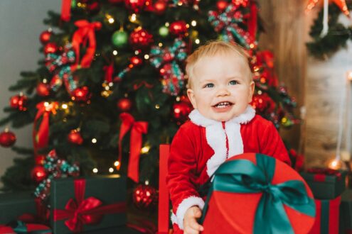 baby in red and white santa costume