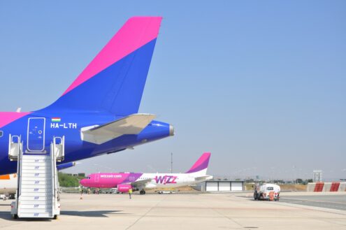 blue and white airplane on airport during daytime