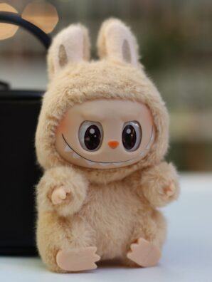 A cute plush toy dressed as a rabbit.