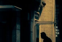 Segnalazioni di operazioni sospette, Sicilia al sesto posto in Italia A man in silhouette using an ATM machine in an urban area of Cide, Kastamonu, Türkiye.