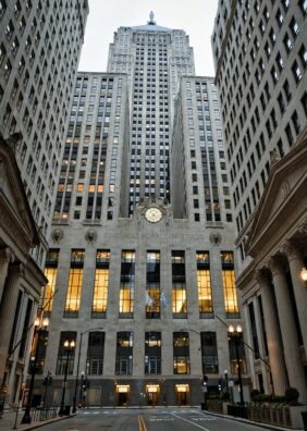 The Chicago Board of Trade Building stands tall amidst historic architecture in downtown Chicago.