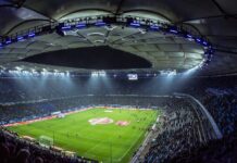 Il calciomercato italiano e il suo legame con le scommesse online high angel photography of football stadium