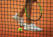 Torneo open maschile e femminile “”Tre Torri”” a Campobello di Licata person wearing pair of white low-top sneakers while holding Wilson tennis racket
