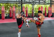 Canicattì, Grest Muay Thai camp 026 con il campione mondiale Fabio Cacciatore A couple of men standing next to each other in a gym