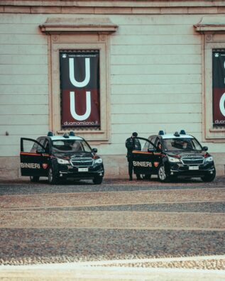 a couple of police cars parked next to each other