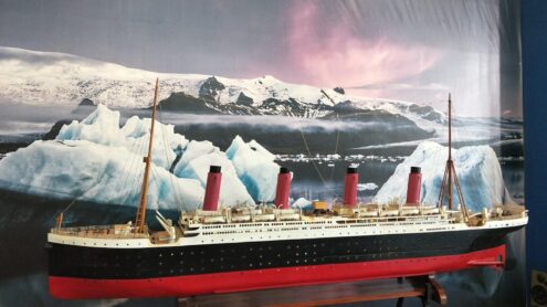 a model of a ship with icebergs in the background
